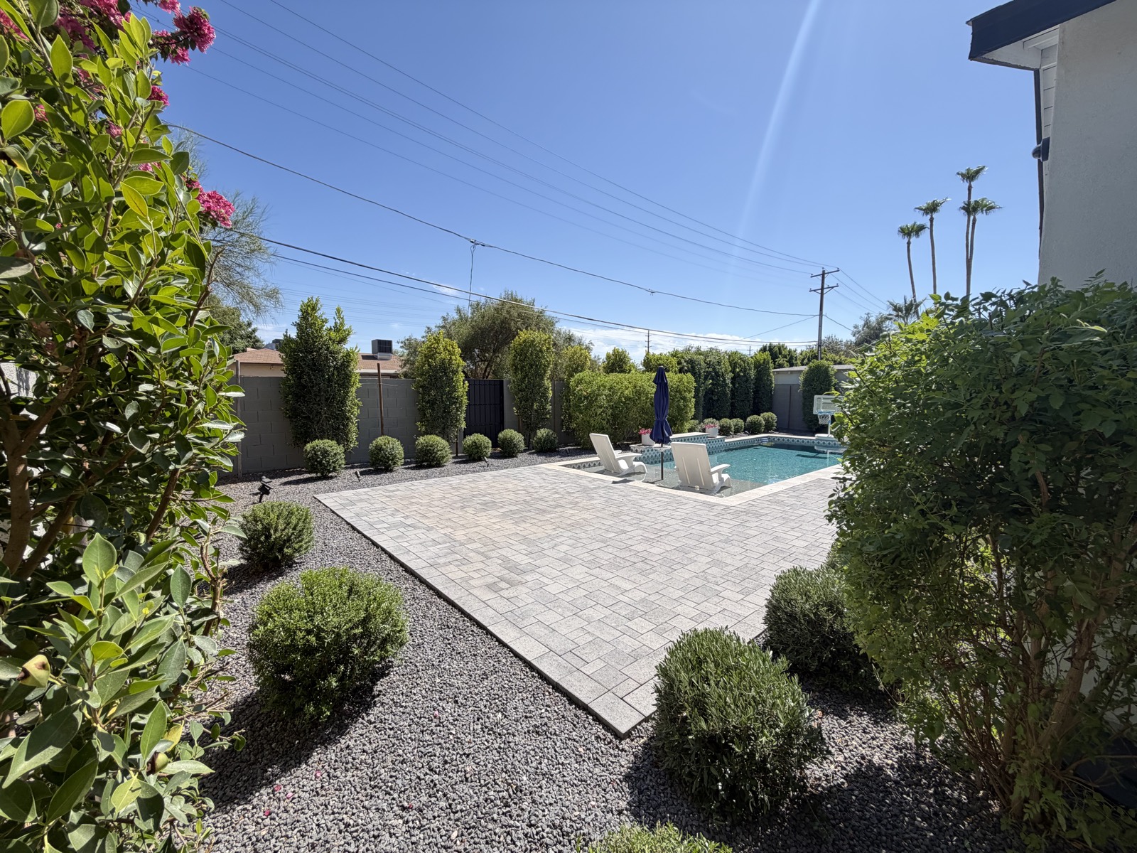Paver patio and backyard landscaping with pool